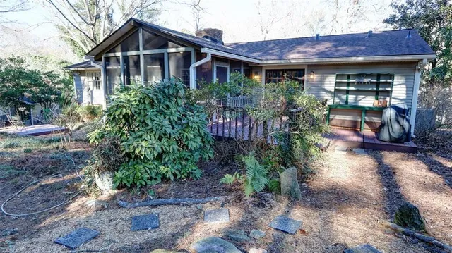 a view of a house with wooden deck