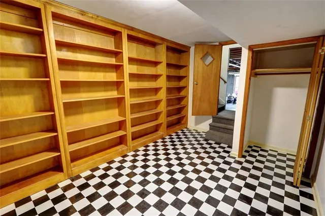 a front view of a house with yard and green space