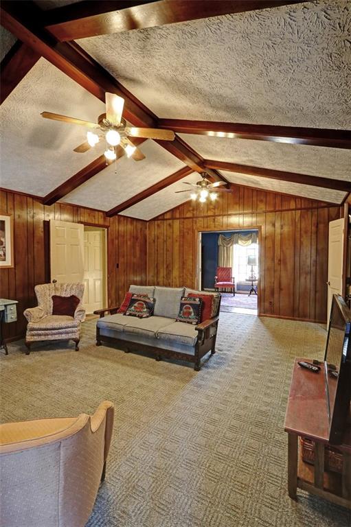 253 Newport Road Southwest Lilburn, GA 30047 - Photo 9 of 40 a living room with furniture and a chandelier