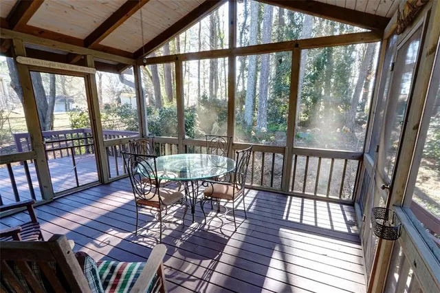 a view of a balcony with wooden floor