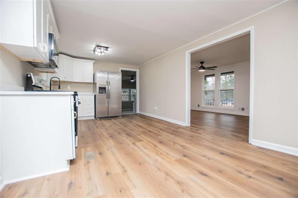 757 North Burnt Hickory Road Douglasville, GA 30134 - Photo 13 of 51 a view of a kitchen with a sink and a refrigerator