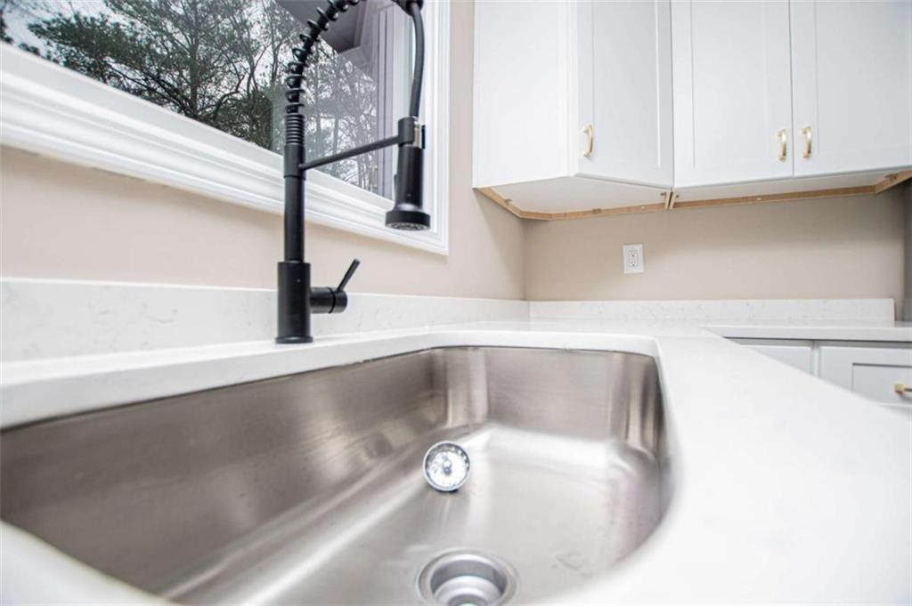 757 North Burnt Hickory Road Douglasville, GA 30134 - Photo 16 of 51 a kitchen with a sink and a window