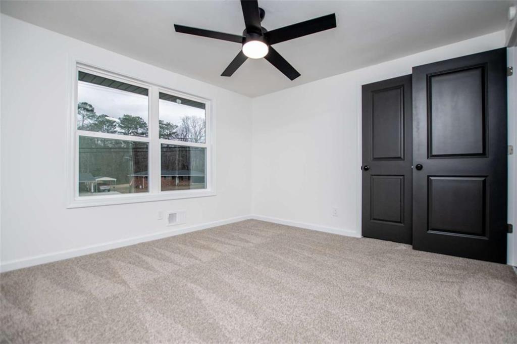 757 North Burnt Hickory Road Douglasville, GA 30134 - Photo 20 of 51 a view of an empty room with a window