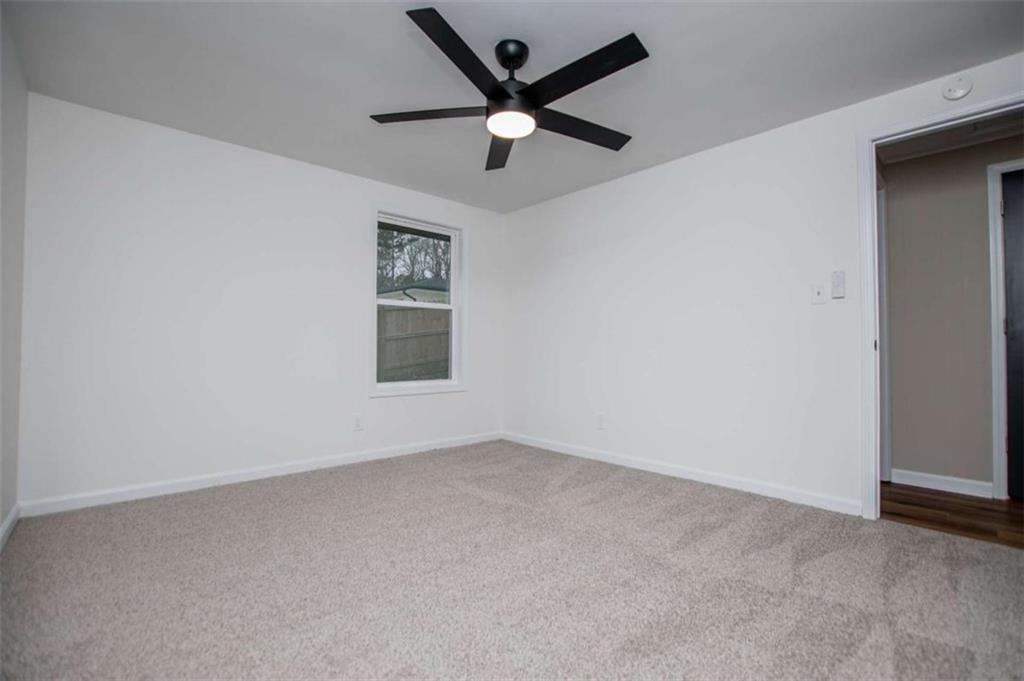 757 North Burnt Hickory Road Douglasville, GA 30134 - Photo 25 of 51 an empty room with a window and a fan