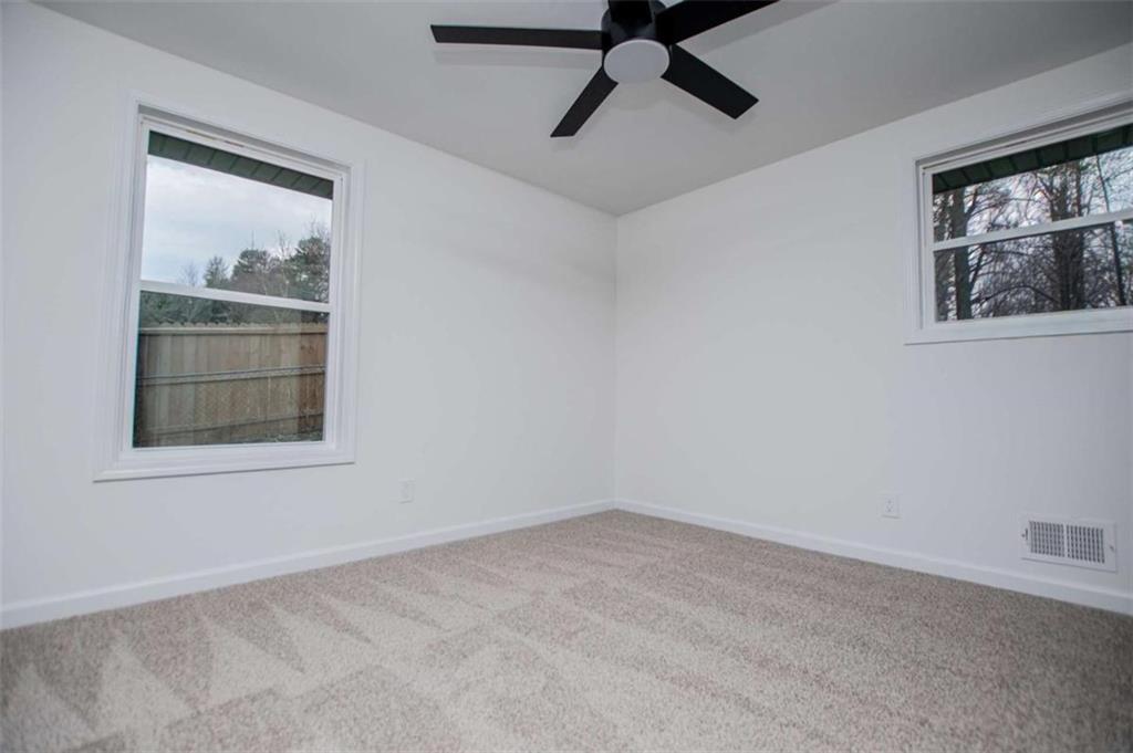 757 North Burnt Hickory Road Douglasville, GA 30134 - Photo 27 of 51 a view of empty room with window and ceiling fan