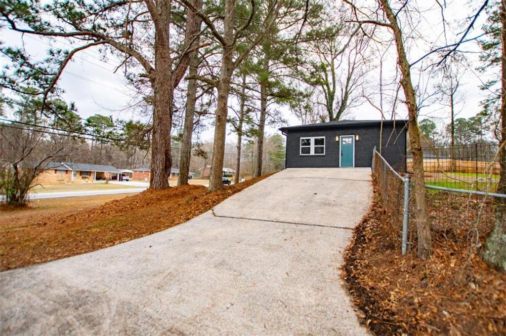 757 North Burnt Hickory Road Douglasville, GA 30134 - Photo 3 of 51 a view of outdoor space with trees