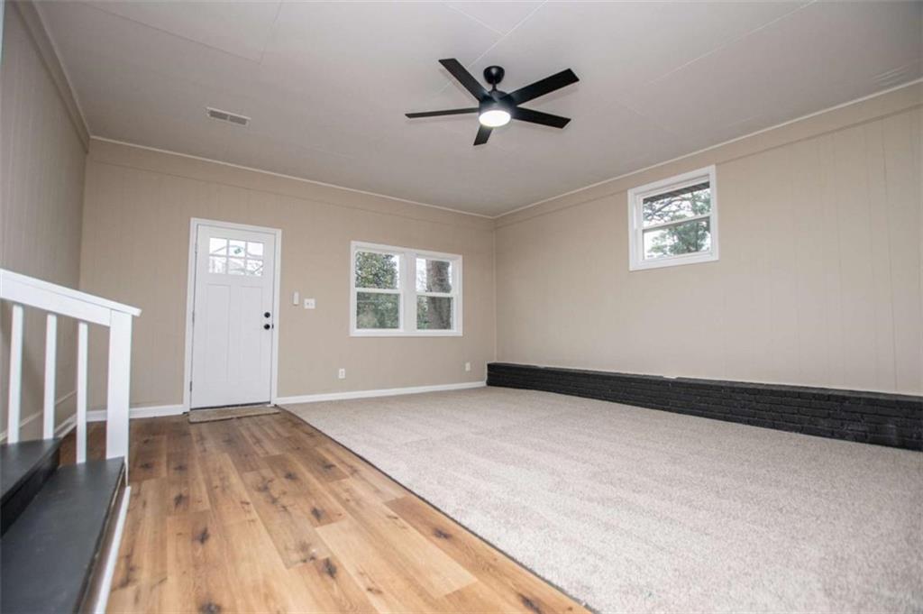 757 North Burnt Hickory Road Douglasville, GA 30134 - Photo 33 of 51 a view of an empty room with wooden floor and a window