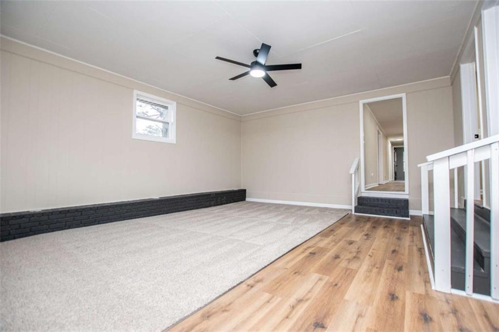 757 North Burnt Hickory Road Douglasville, GA 30134 - Photo 35 of 51 a view of empty room with wooden floor