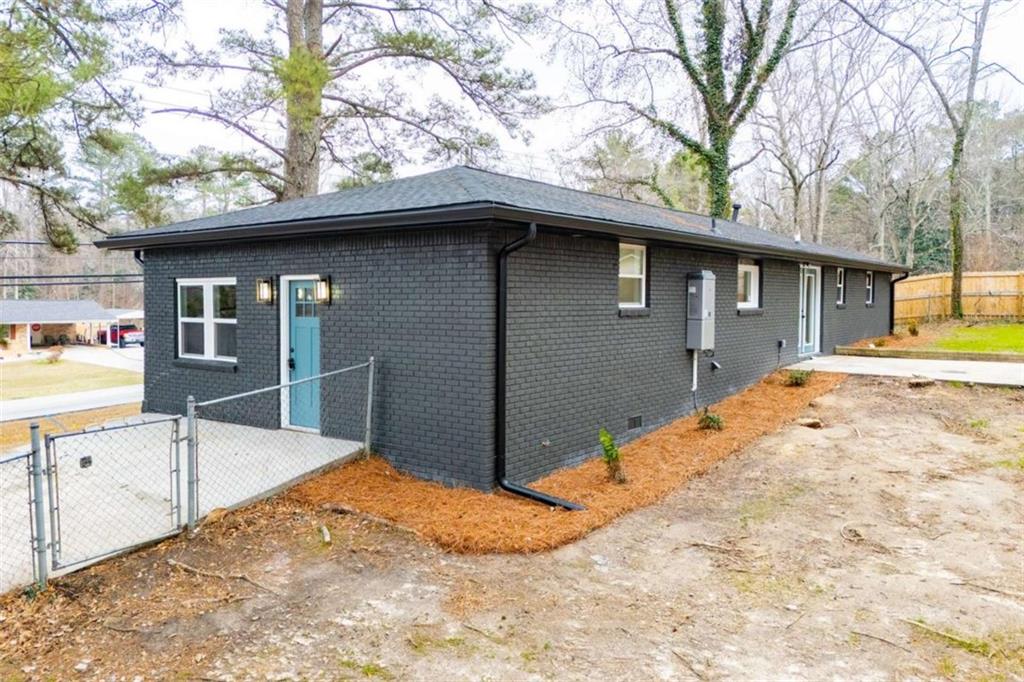 757 North Burnt Hickory Road Douglasville, GA 30134 - Photo 4 of 51 a backyard of a house with table and chairs