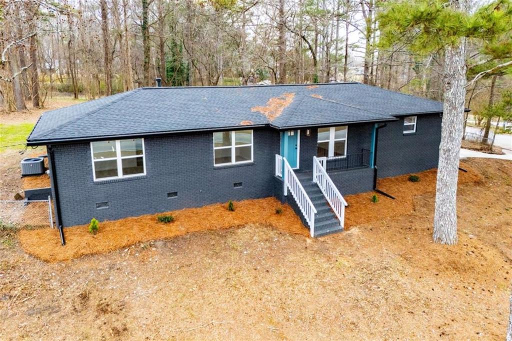 757 North Burnt Hickory Road Douglasville, GA 30134 - Photo 41 of 51 a backyard of a house with yard and outdoor seating