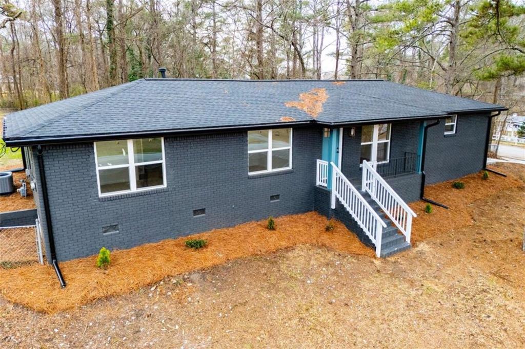 757 North Burnt Hickory Road Douglasville, GA 30134 - Photo 42 of 51 a backyard of a house with barbeque oven