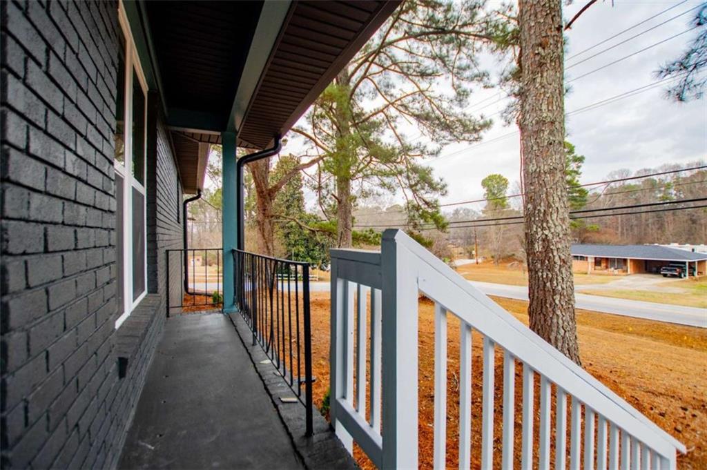 757 North Burnt Hickory Road Douglasville, GA 30134 - Photo 48 of 51 a view of a balcony with wooden floor and fence