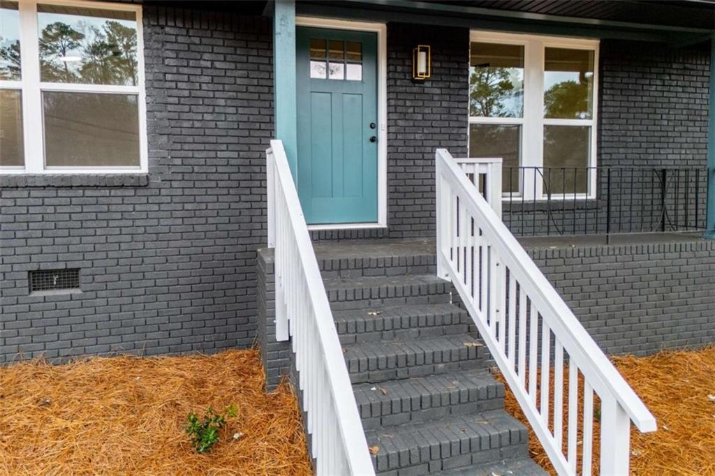 757 North Burnt Hickory Road Douglasville, GA 30134 - Photo 6 of 51 a view of a balcony with wooden floor and fence