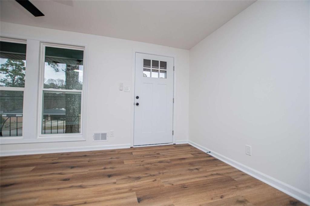 757 North Burnt Hickory Road Douglasville, GA 30134 - Photo 9 of 51 a view of empty room with wooden floor and fan