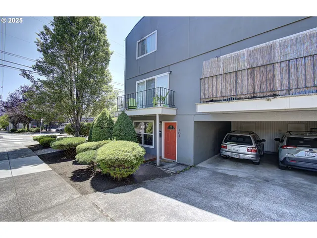 a view of a car parked in front of a building