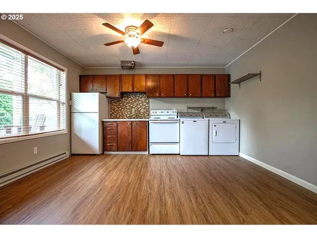 a view of a kitchen with a sink and a window