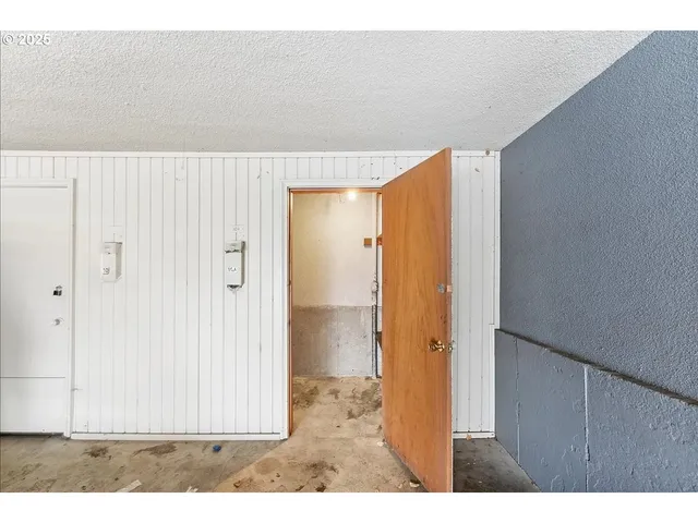 a backyard of a house with outdoor seating and plants