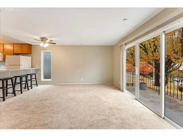 a view of a room with a large window