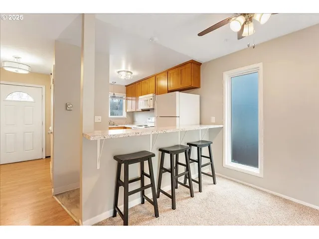 a open kitchen with a table and chairs in it