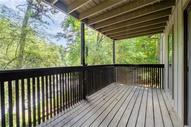 a balcony with wooden floor in outdoor space