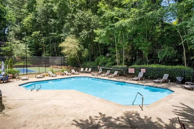 a view of a swimming pool with lounge chair