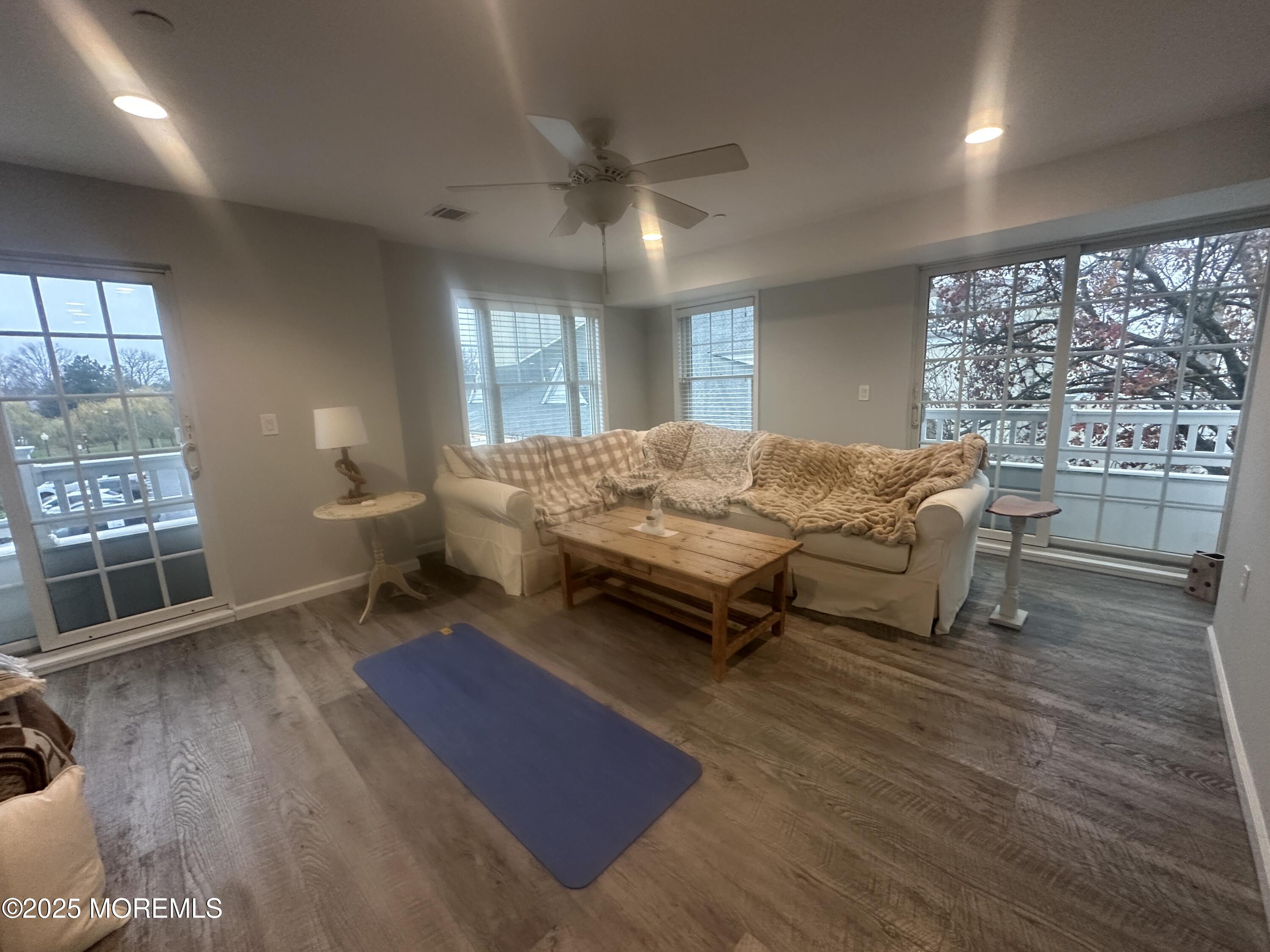 177 Main Street, Unit 2B Manasquan, NJ 08736 - Photo 4 of 13 a bedroom with furniture and a large window