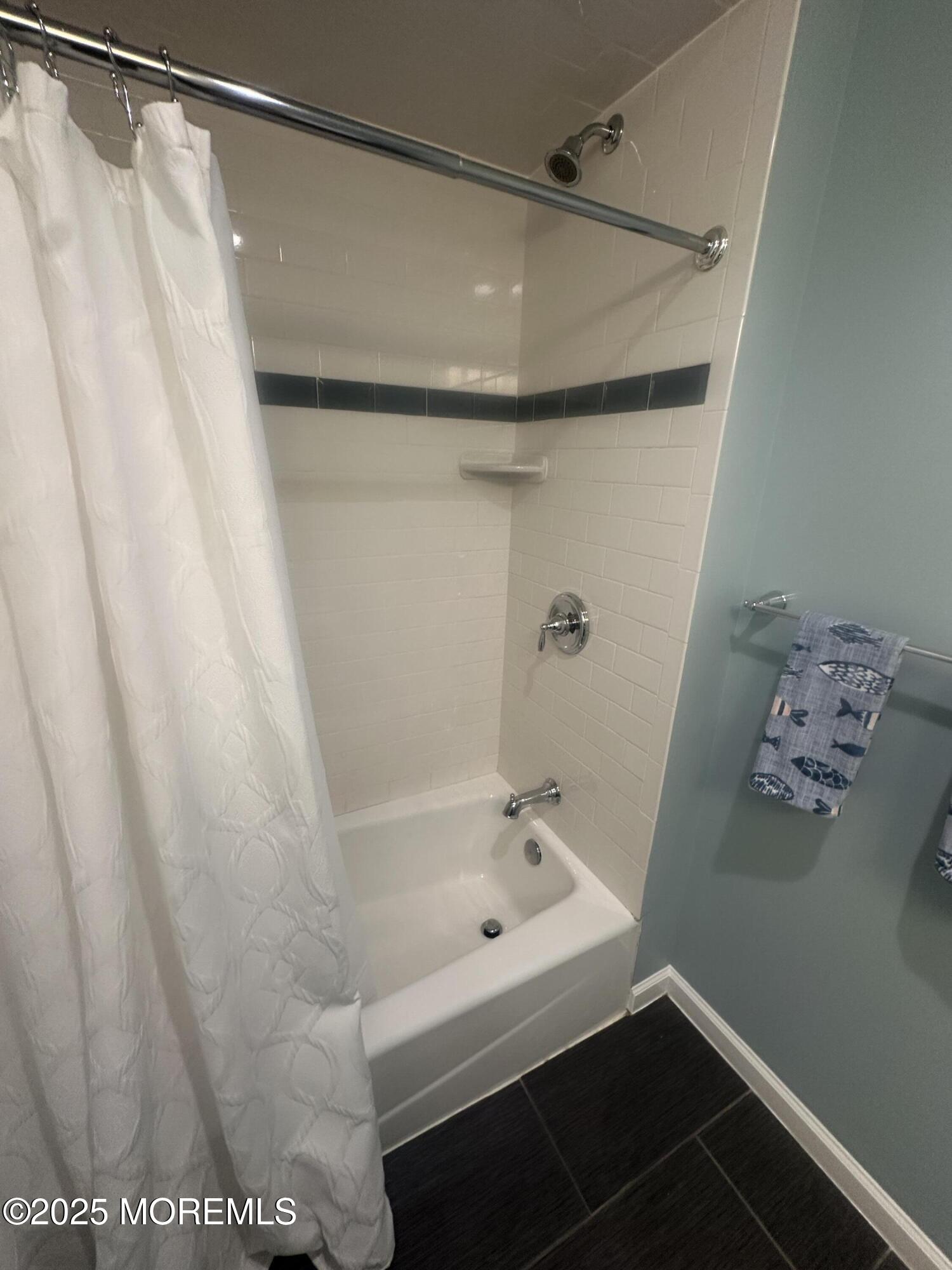 177 Main Street, Unit 2B Manasquan, NJ 08736 - Photo 7 of 13 a bathroom with a bathtub and shower