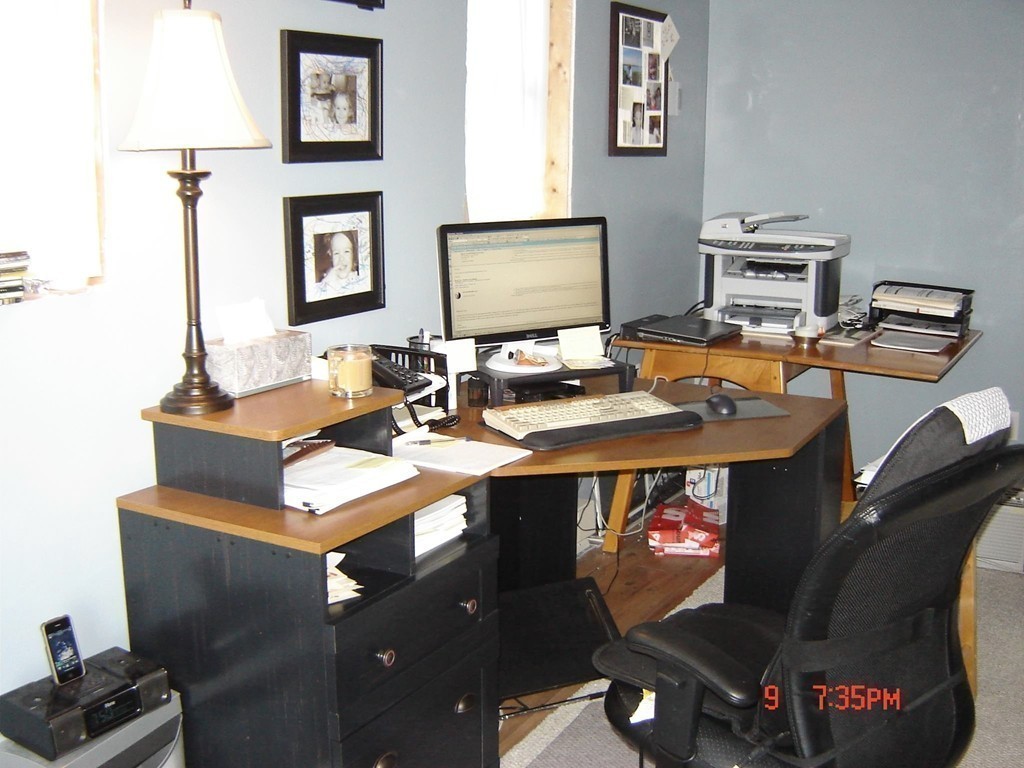 20 Bacon Road Weymouth, MA 02191 - Photo 14 of 26 a work room with furniture a flat screen tv and a lamp