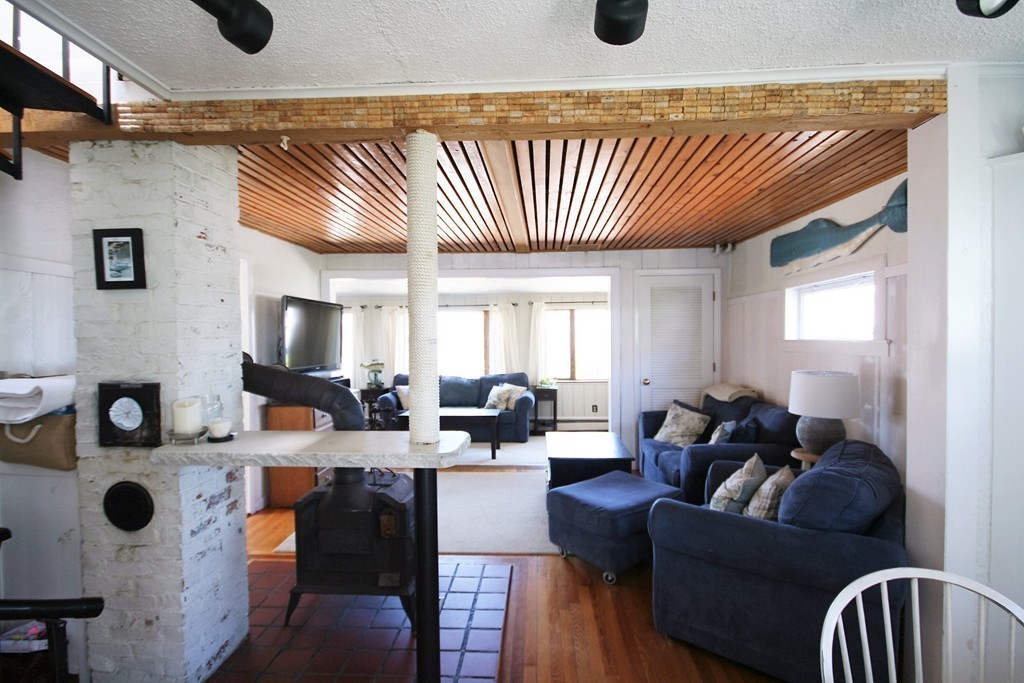 20 Bacon Road Weymouth, MA 02191 - Photo 4 of 26 a living room with furniture and flat screen tv