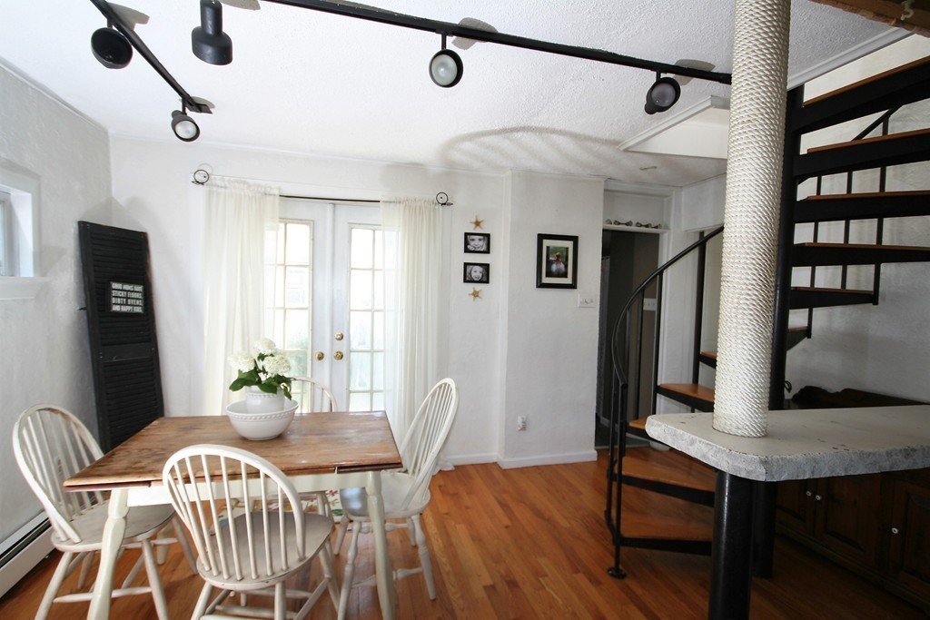 20 Bacon Road Weymouth, MA 02191 - Photo 8 of 26 a view of a dining room with furniture and wooden floor