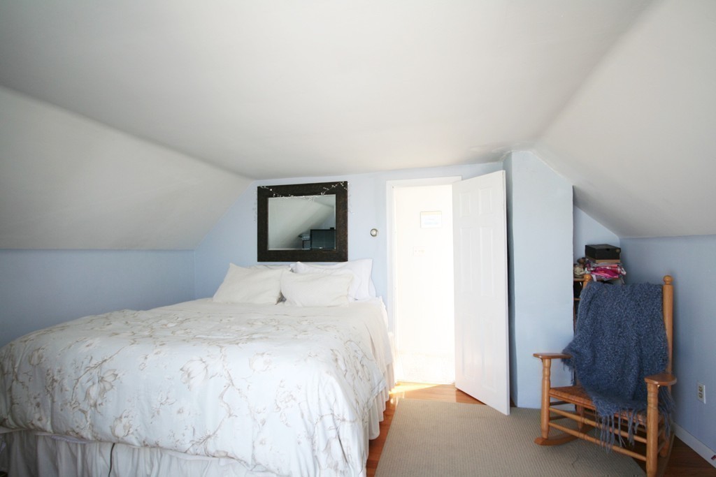 20 Bacon Road Weymouth, MA 02191 - Photo 9 of 26 a bedroom with a bed and a desk
