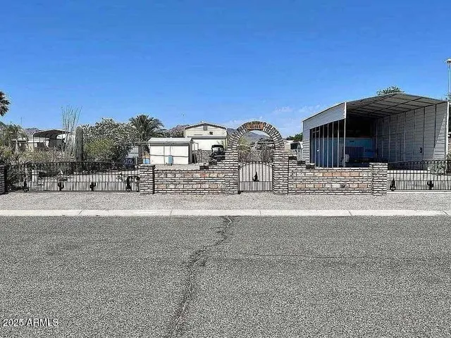 a view of a house with a snow on the road