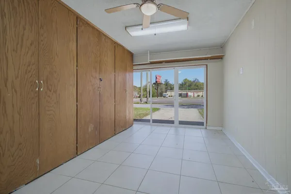 a view of an empty room with a window
