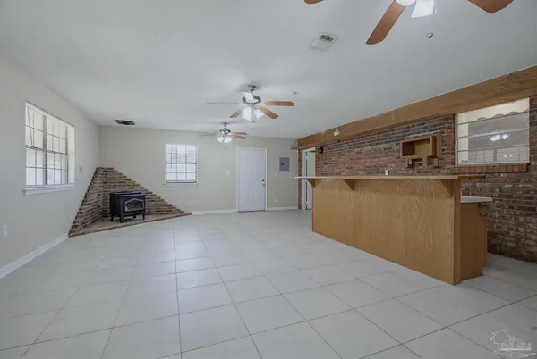 a view of a kitchen with a sink and a chandelier