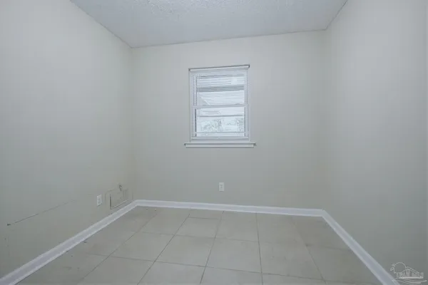 a view of a room that has a window in it