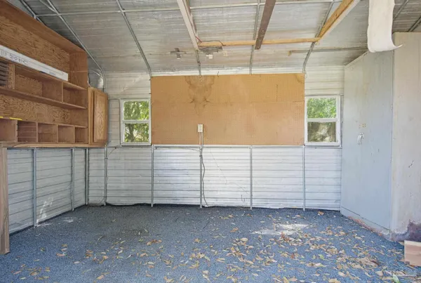 a view of a room with wooden walls