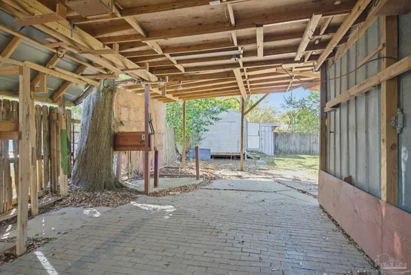 a view of a bathroom with a window and a kitchen view