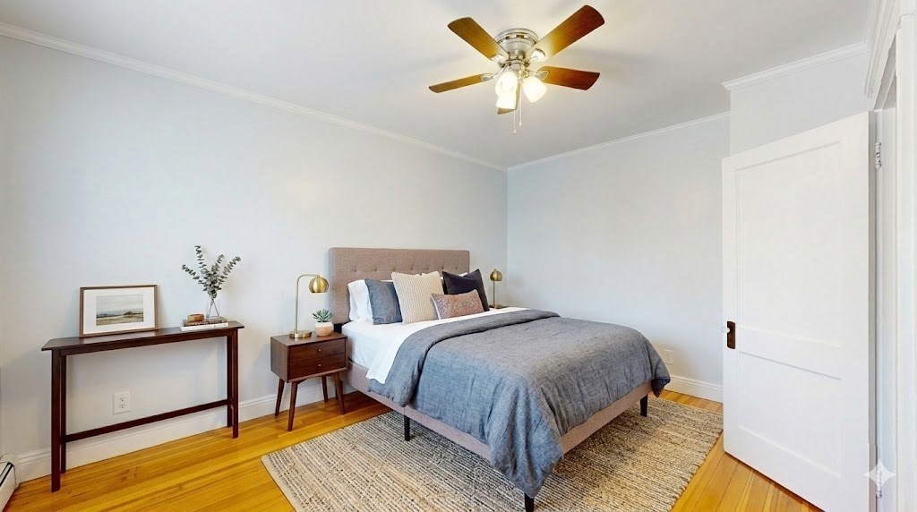 5 Ropes Street, Unit 2 Salem, MA 01970 - Photo 5 of 8 a bedroom with a bed and a ceiling fan