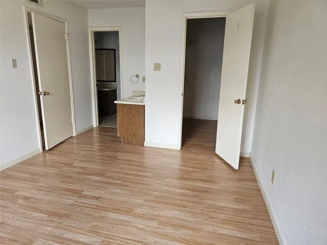 a view of a kitchen from the hallway