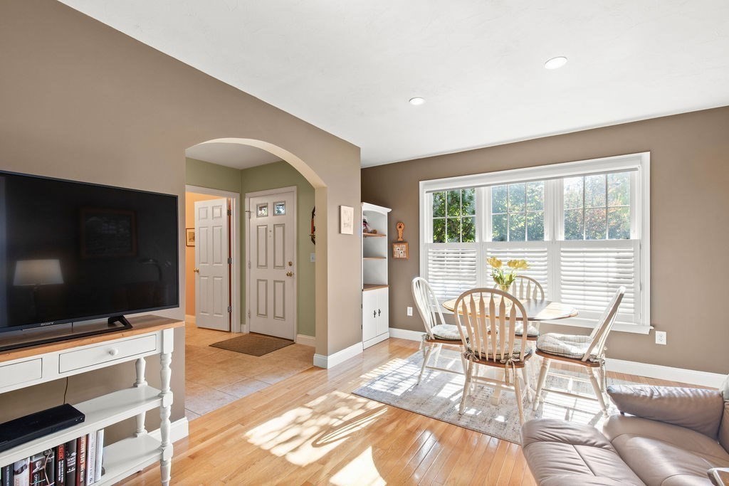 44 Stratford Ridge, Unit 44 Mashpee, MA 02649 - Photo 15 of 40 a living room with furniture and a flat screen tv