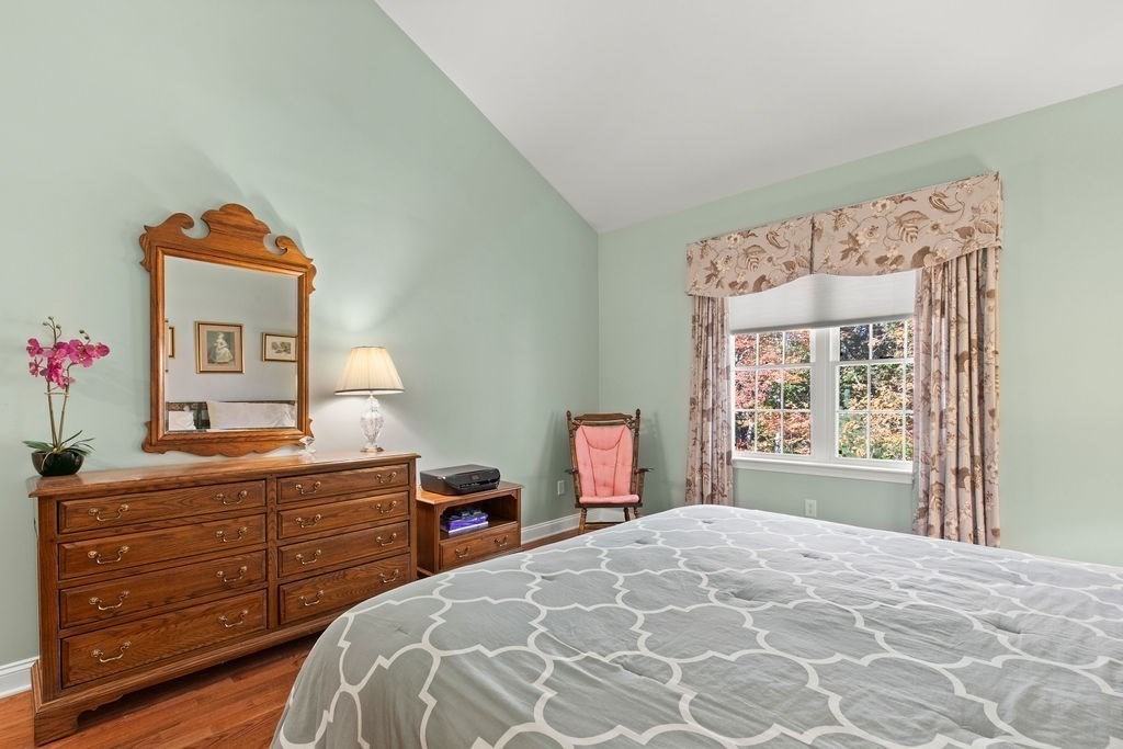 44 Stratford Ridge, Unit 44 Mashpee, MA 02649 - Photo 18 of 40 a bedroom with a bed and a window