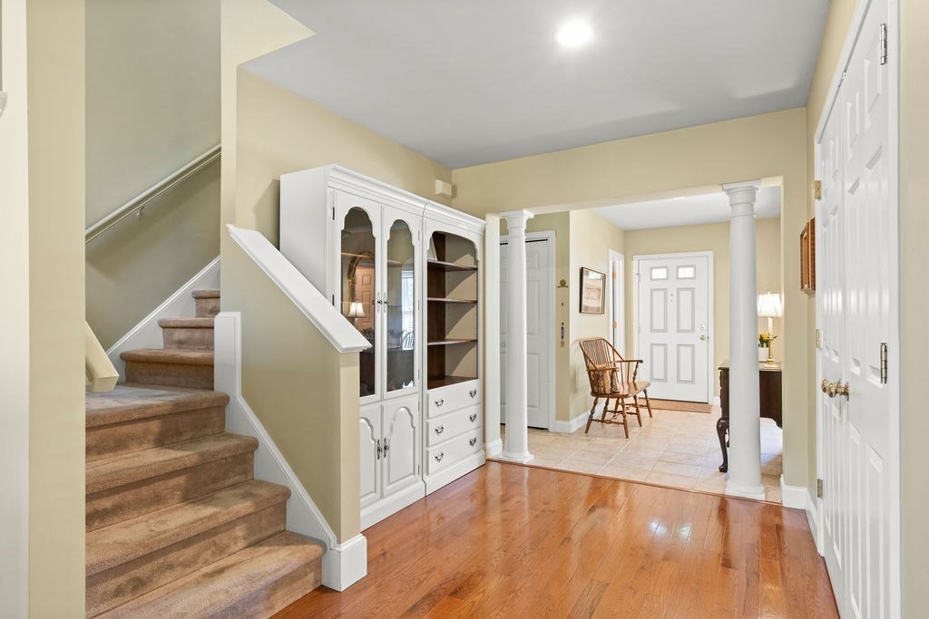 44 Stratford Ridge, Unit 44 Mashpee, MA 02649 - Photo 19 of 40 a view of entryway and hall with wooden floor