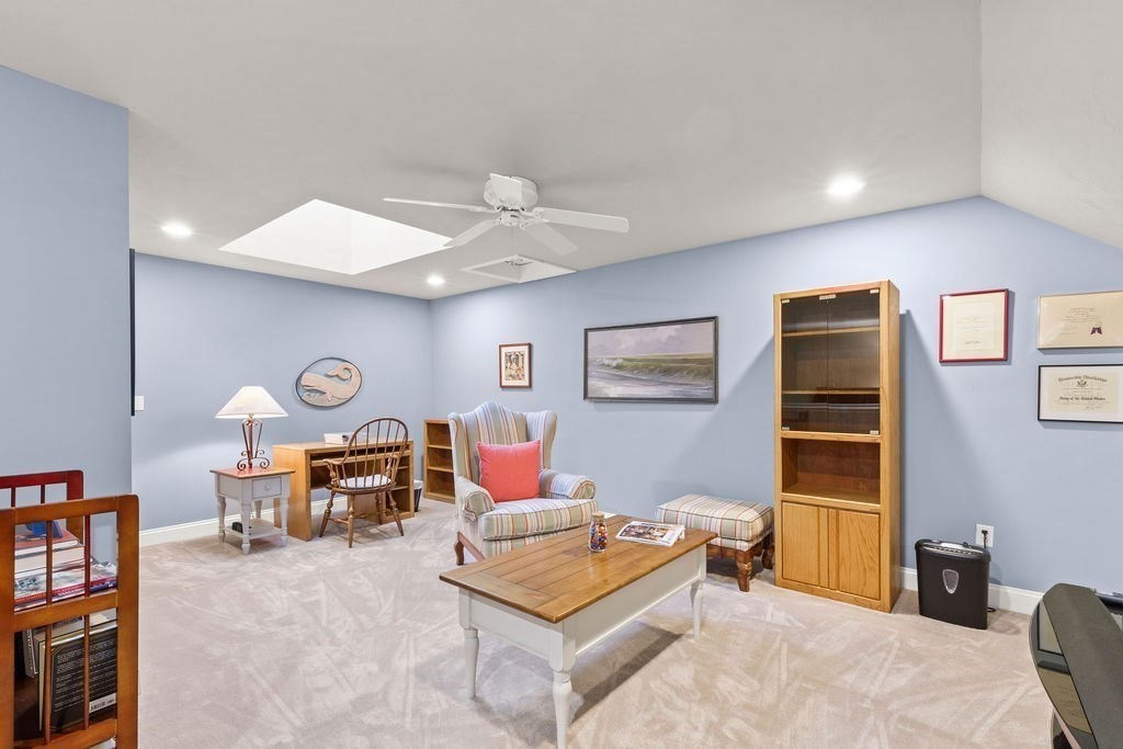 44 Stratford Ridge, Unit 44 Mashpee, MA 02649 - Photo 21 of 40 a living room with furniture and a table