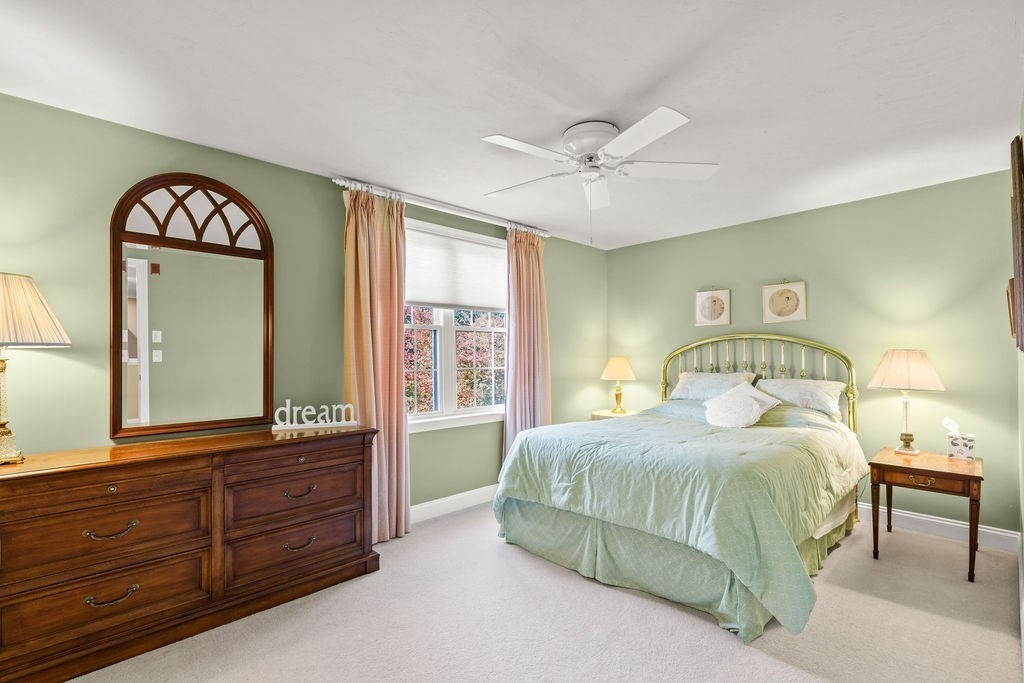 44 Stratford Ridge, Unit 44 Mashpee, MA 02649 - Photo 25 of 40 a bedroom with a bed and a dresser