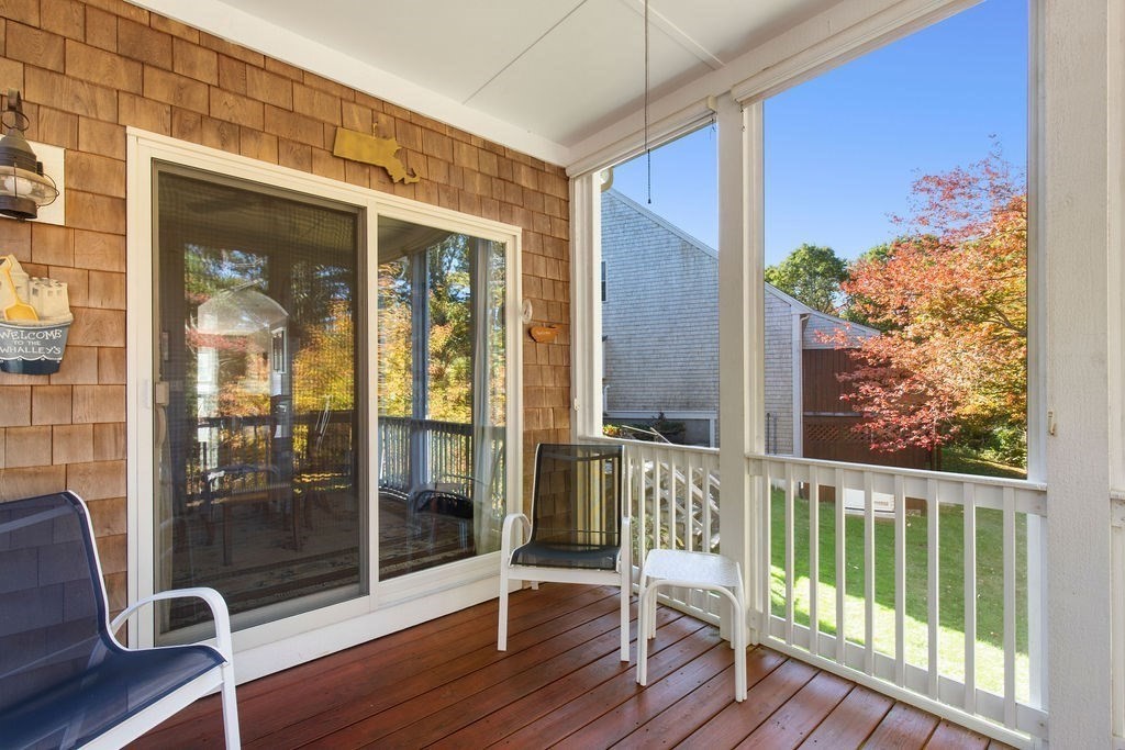 44 Stratford Ridge, Unit 44 Mashpee, MA 02649 - Photo 26 of 40 a view of a balcony with wooden floor