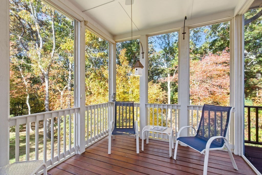 44 Stratford Ridge, Unit 44 Mashpee, MA 02649 - Photo 28 of 40 a view of a porch with wooden floor and outdoor space
