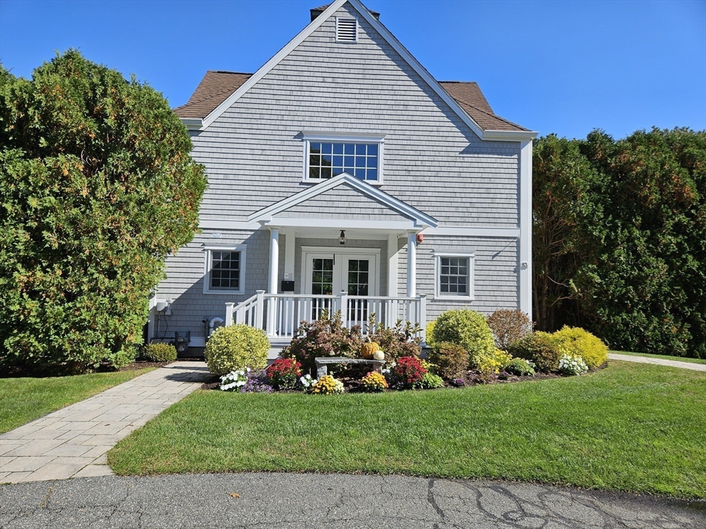 44 Stratford Ridge, Unit 44 Mashpee, MA 02649 - Photo 35 of 40 a front view of a house with garden