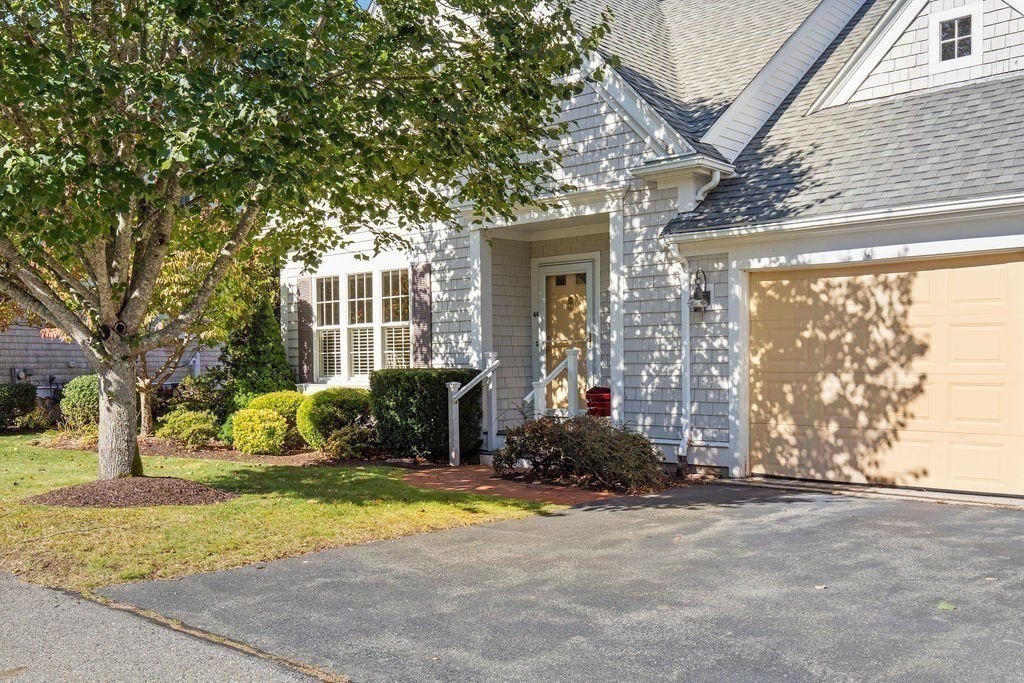 44 Stratford Ridge, Unit 44 Mashpee, MA 02649 - Photo 40 of 40 a view of a house with backyard and sitting area