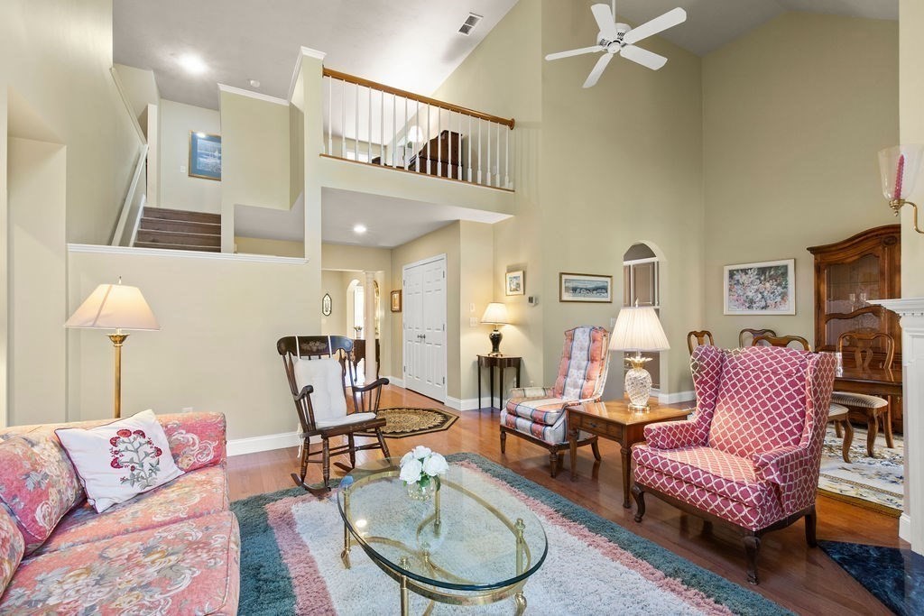 44 Stratford Ridge, Unit 44 Mashpee, MA 02649 - Photo 7 of 40 a living room with furniture and a lamp