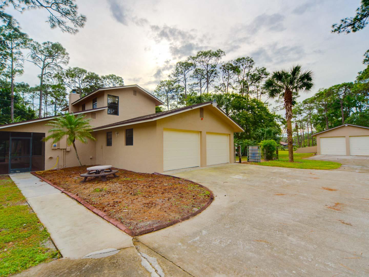 2477 West G Road Loxahatchee, FL 33470 - Photo 5 of 61 a view of a house with a patio